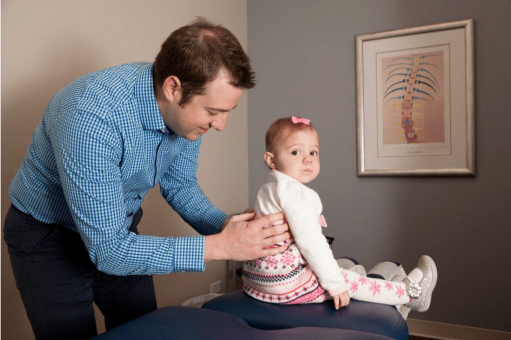 pediatric chiropractor with a little girl