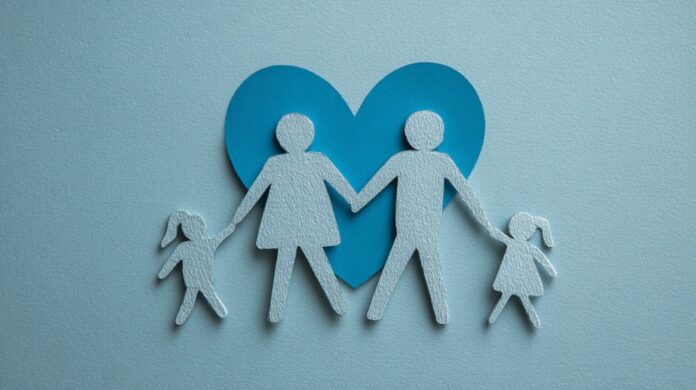 Family Health Protection - Proper Planning for Future Needs Paper cutout of a family holding hands with a blue heart in the background
